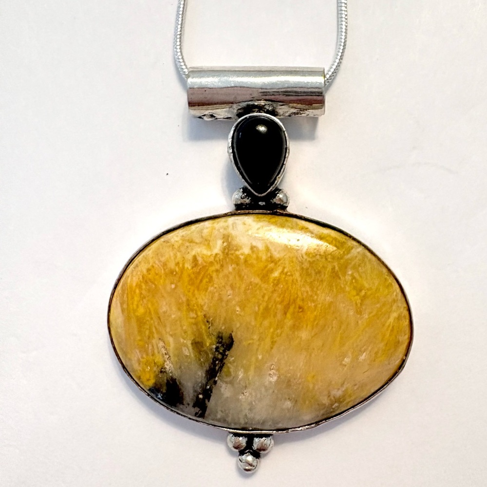 2 inch, 925  marked, Decent Bumble Bee Jasper, and Black Onyx on a silver chain.